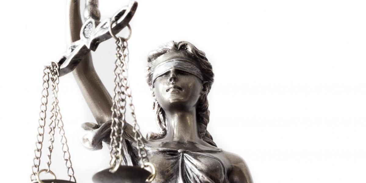 A Lady Justice statue, blindfolded and holding scales