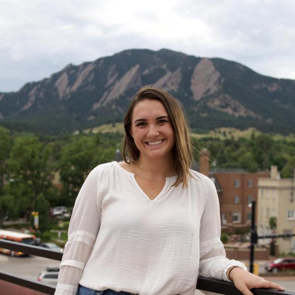 Jessica Bixler stands in front of the flat irons. 