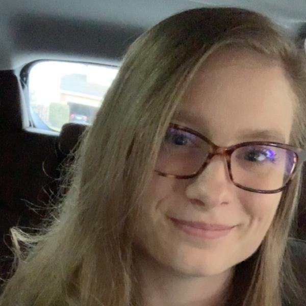Cassandra Cunningham smiles from inside a car