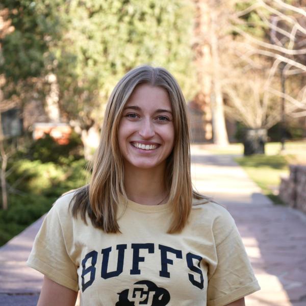 Taylor Furrh stands on side walk.