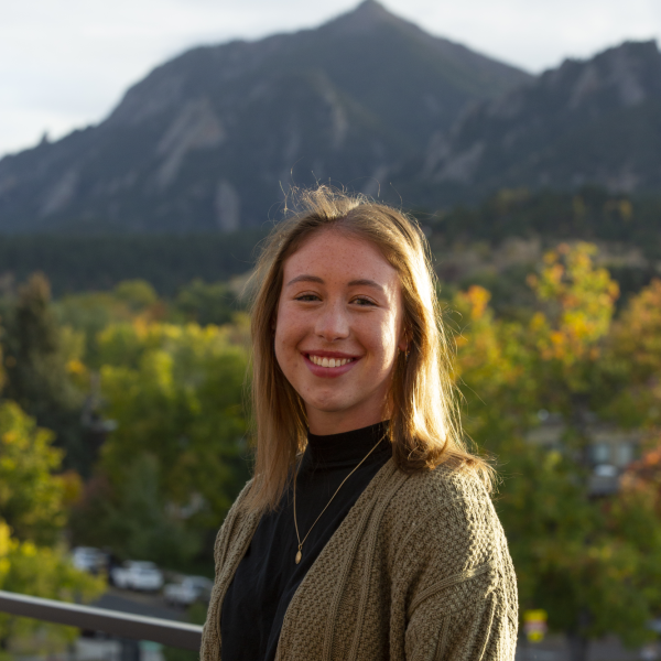 Julianne Marsh standing in front of mountains