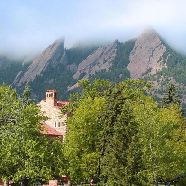 Norlin Quad with the Flatirons mountains in the background, shrouded in fog