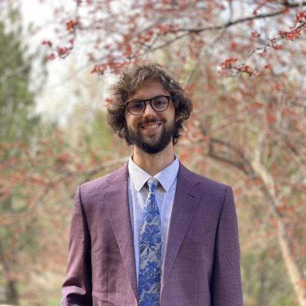 Will Stritzel stands in front of a tree.