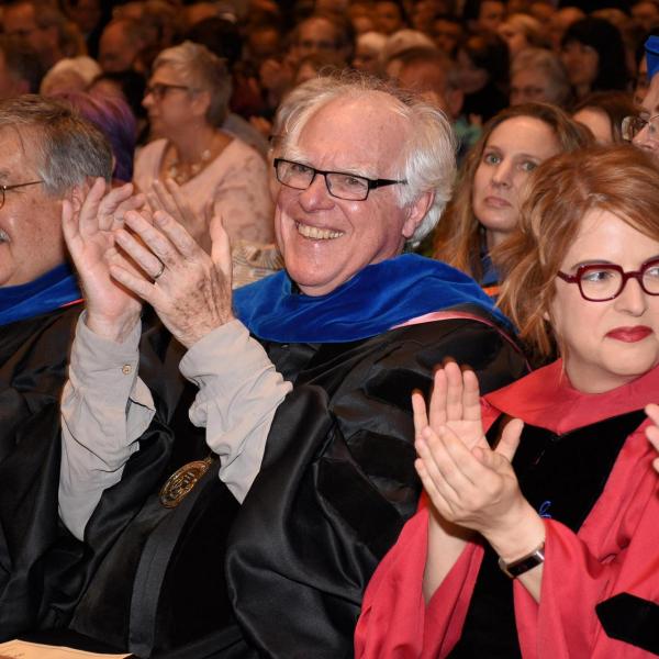 Professors applauding our outstanding students