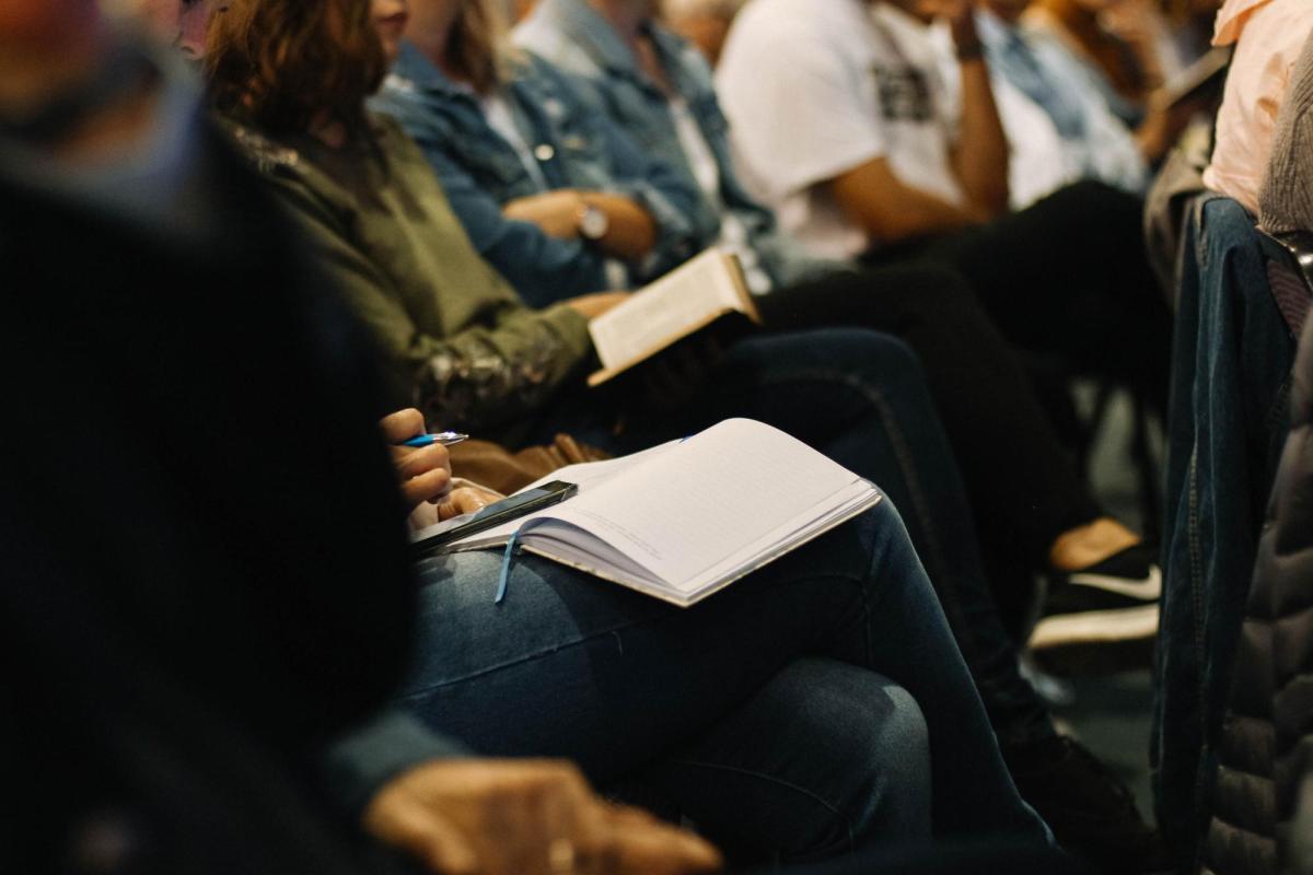 Group of people in an auditorium setting