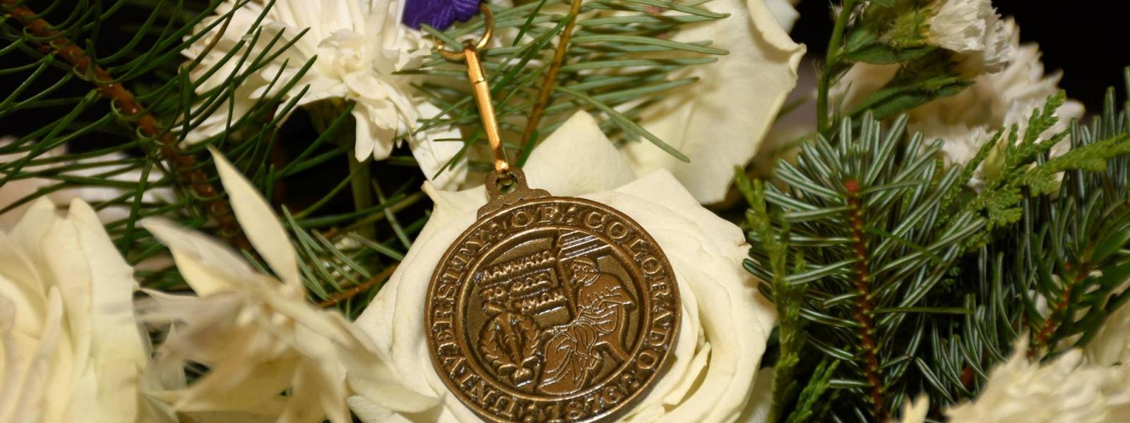 Close-up of a Latin honors medal