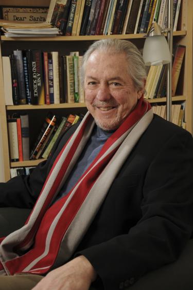 Dr. Paul Strom pictured in his library.