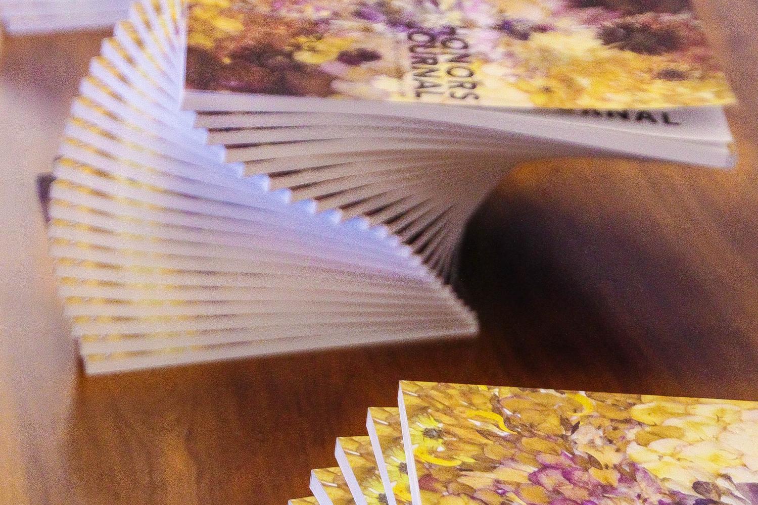 Journals stacked on display