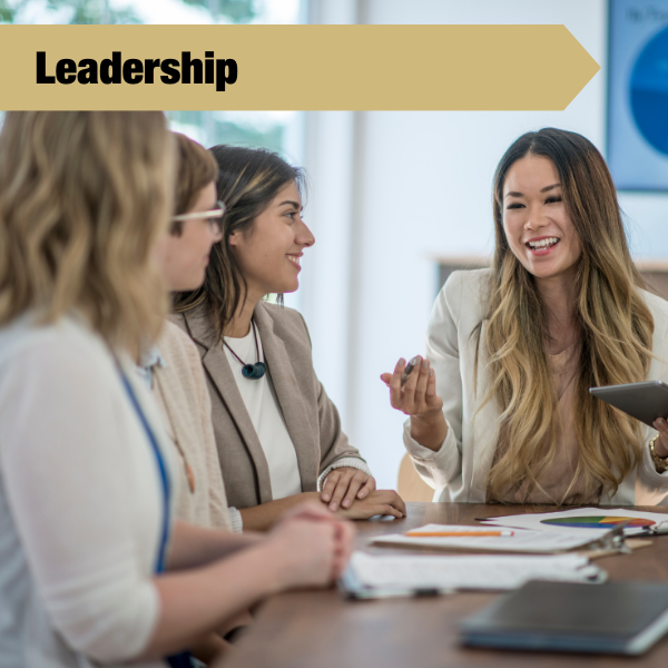 leadership tile with a few people talking to each other at a table