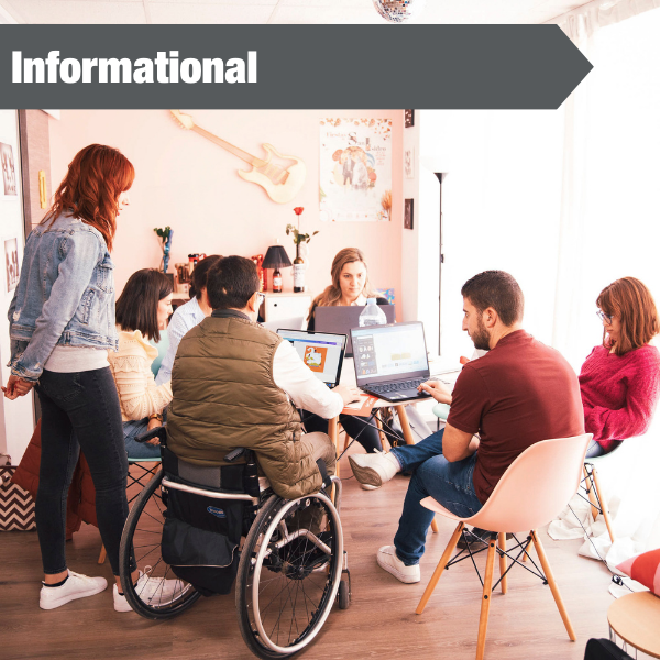 photo of group of people sitting at table working