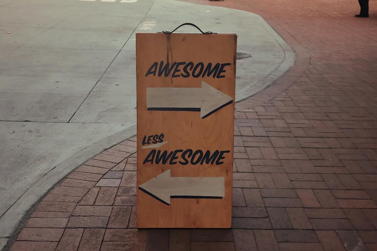 Sign that says awesome and less awesome