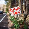 Sign that says Thank You on a road