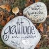 Gratitude written on a rock