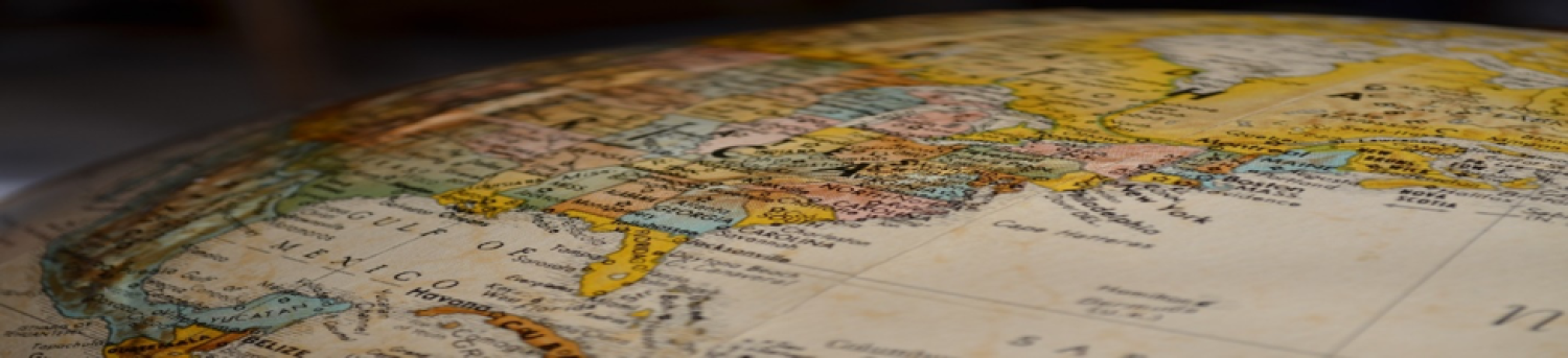 image of a slice of the globe in beige and pastel colors
