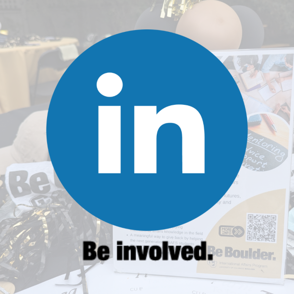 LinkedIn Logo with Be Involved underneath, semitransparent background of a table with IAFS and CU swag