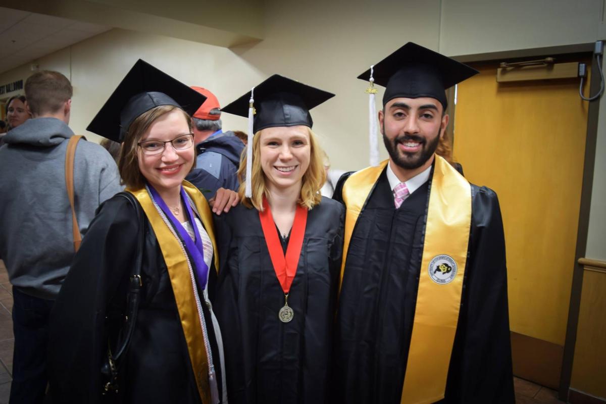 3 graduates in regalia