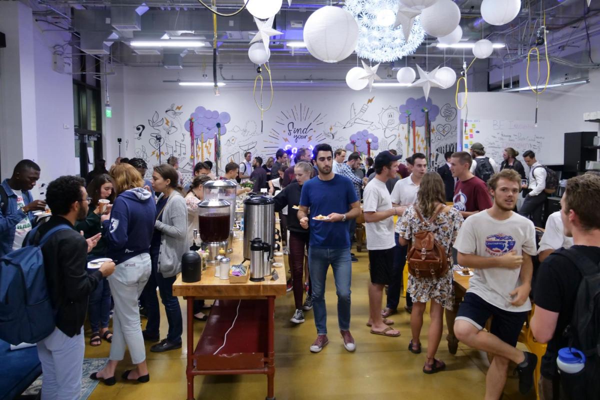 Students and people from the community chat and enjoy refreshments in the Start Up Hub during the New Venture Challenge kick off night. Photo by Patrick Campbell/University of Colorado