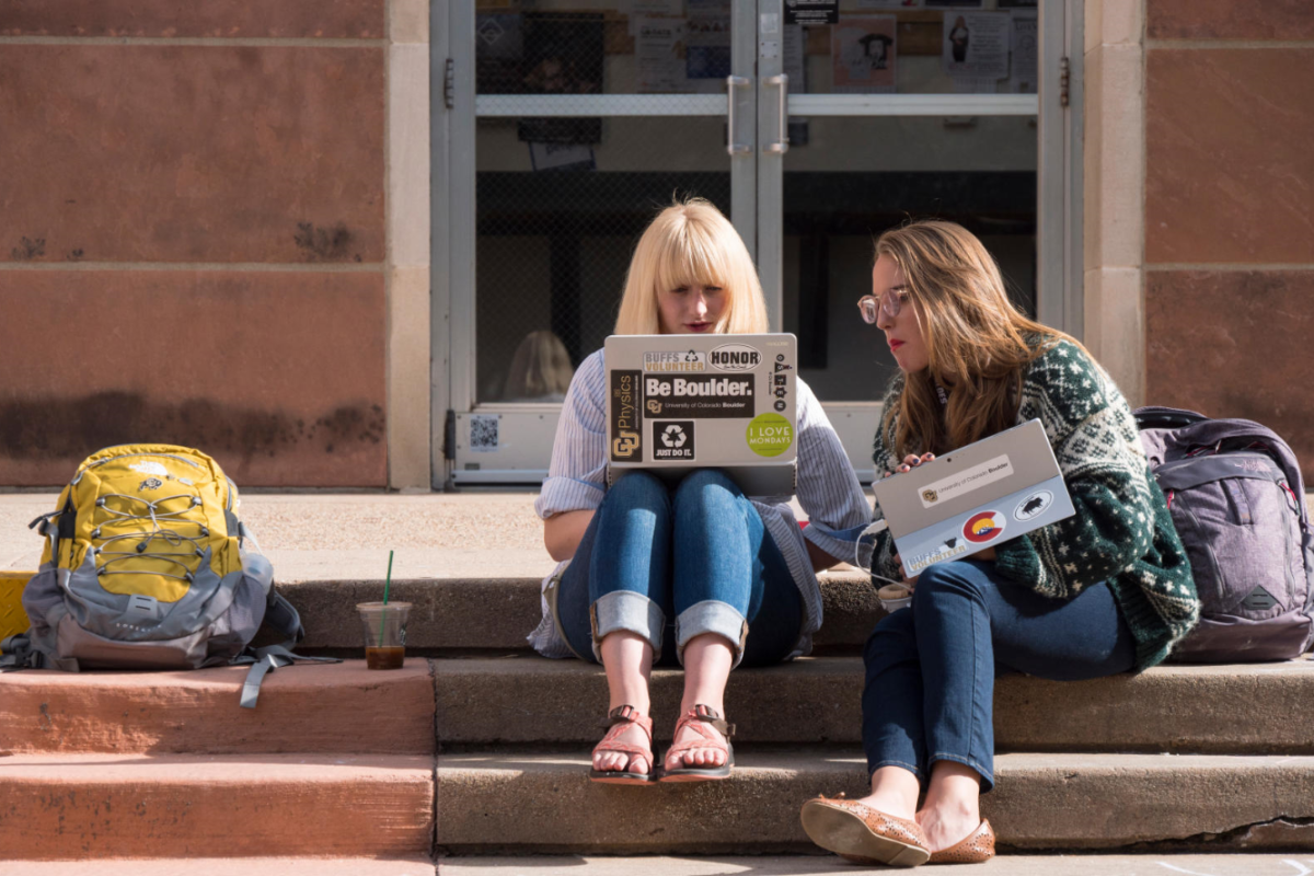 Mary Taggart, a freshman physics major from McKinney, TX, left, and Jessie Pafford, and freshman integrated physiology major from Sanford, NC, study outside of Chem 140. on Nov. 15, 2017. (Photo by Glenn Asakawa/University of Colorado)