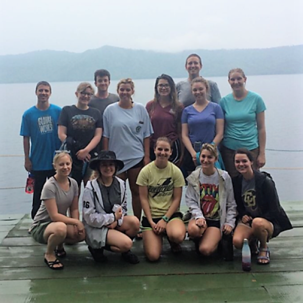 group photo of students on a dock