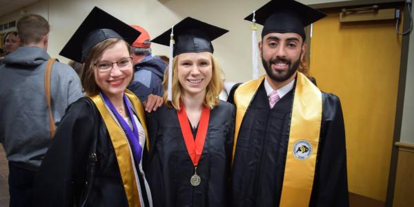 3 graduates in regalia