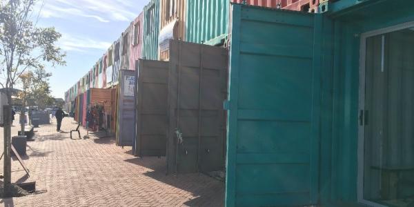 colorful shipping containers made into a business strip mall