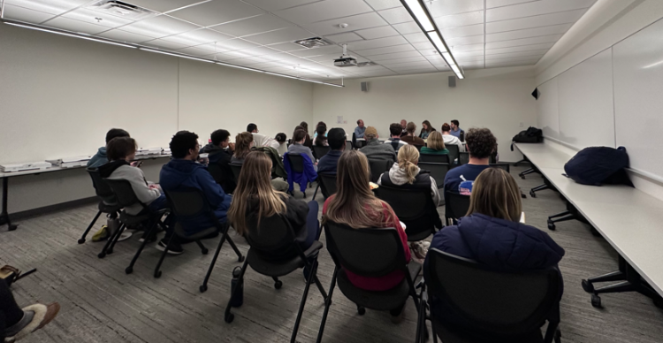students watching panel discussion