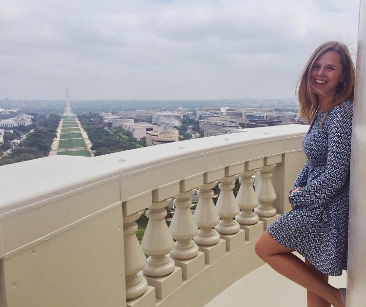 kate henjum standing on balcony overlooking national mall