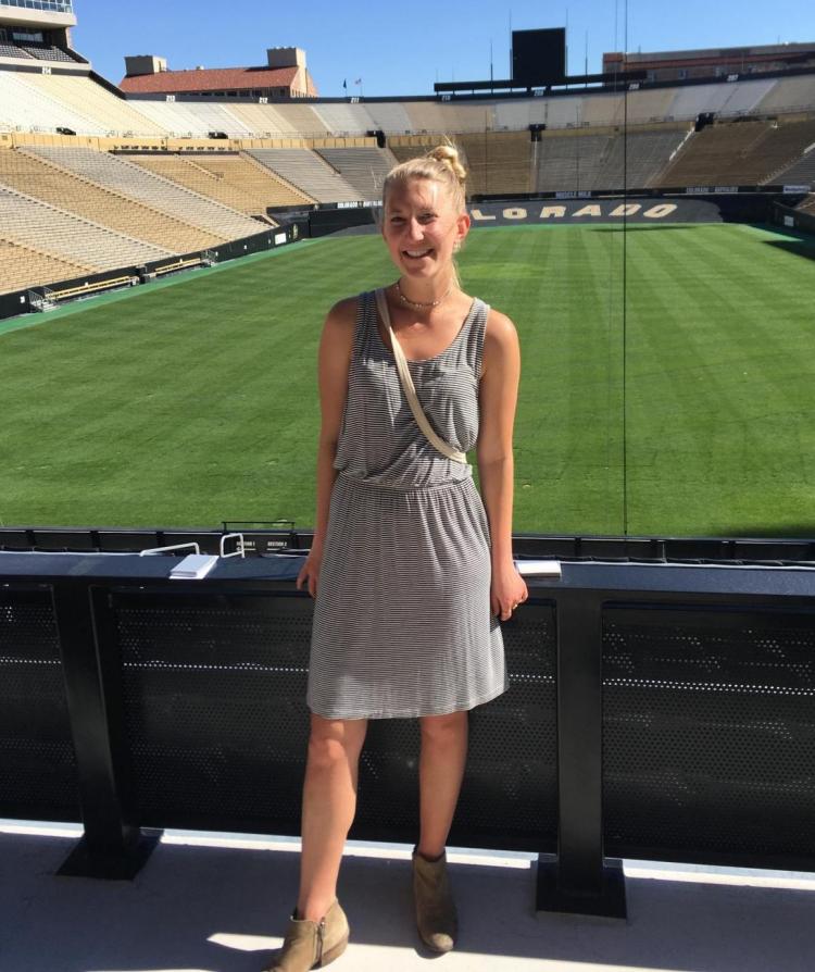 jordan thomas standing at colorado football field