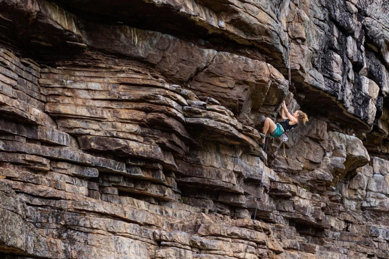 people rock climbing