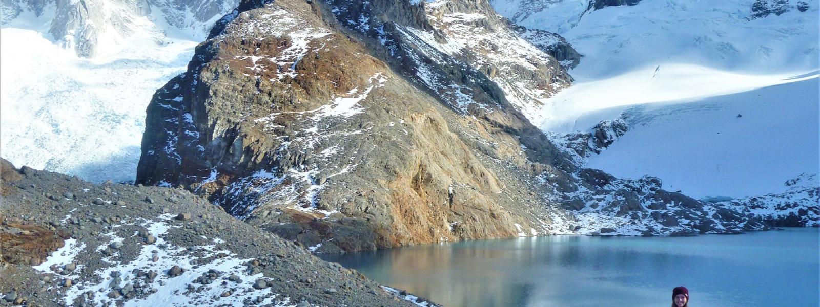 student standing by mountains in winter in argentina
