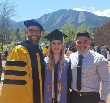three people at cu graduation