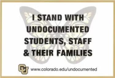 sign stating I stand with undocumented students, staff & their families - CU Boulder