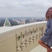 kate henjum standing on balcony overlooking national mall