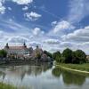 german river bend with buildings