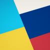 geometric graphic of Russia flag and Ukraine flag colors next to each other.