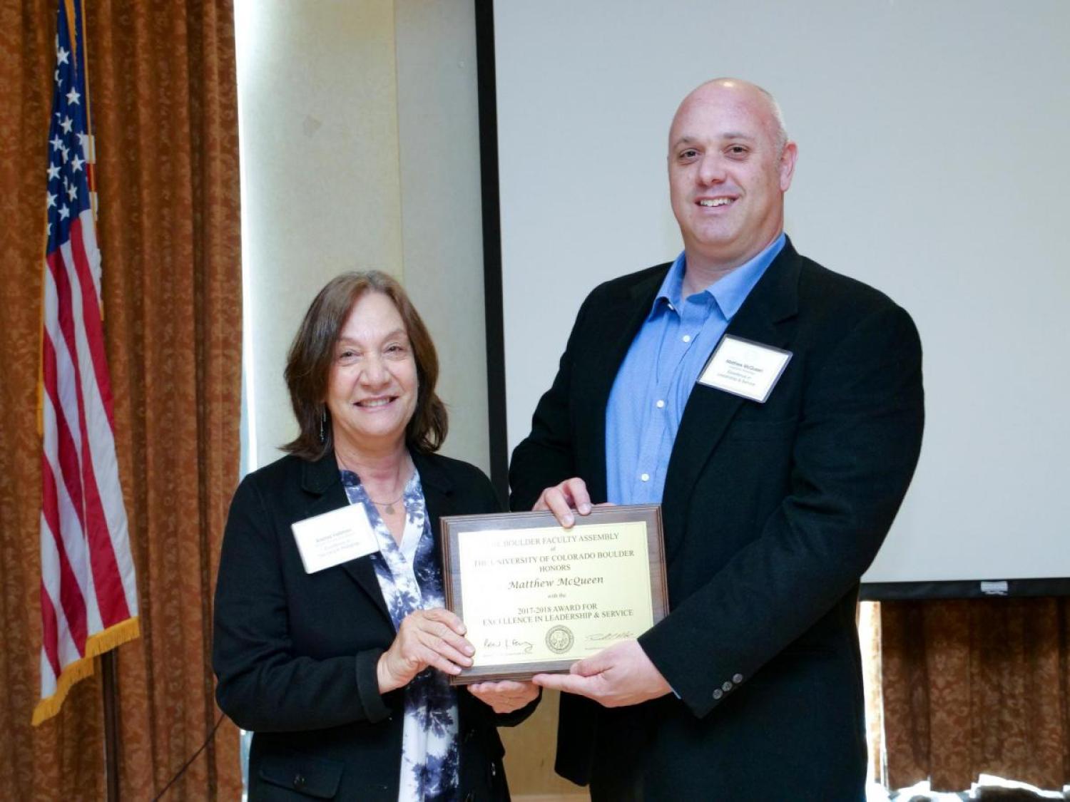 Leadership and Service Award Selection Committee Chair Andrea Feldman and recipient Matthew McQueen