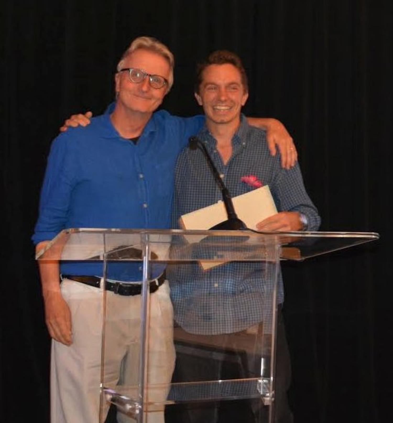 Spencer Huggett accepts the award from Eric Turkheimer