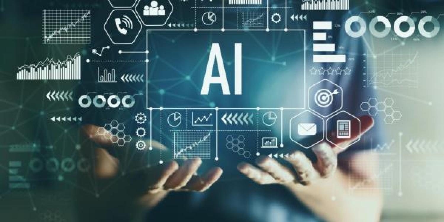 man holding an infographic of AI components