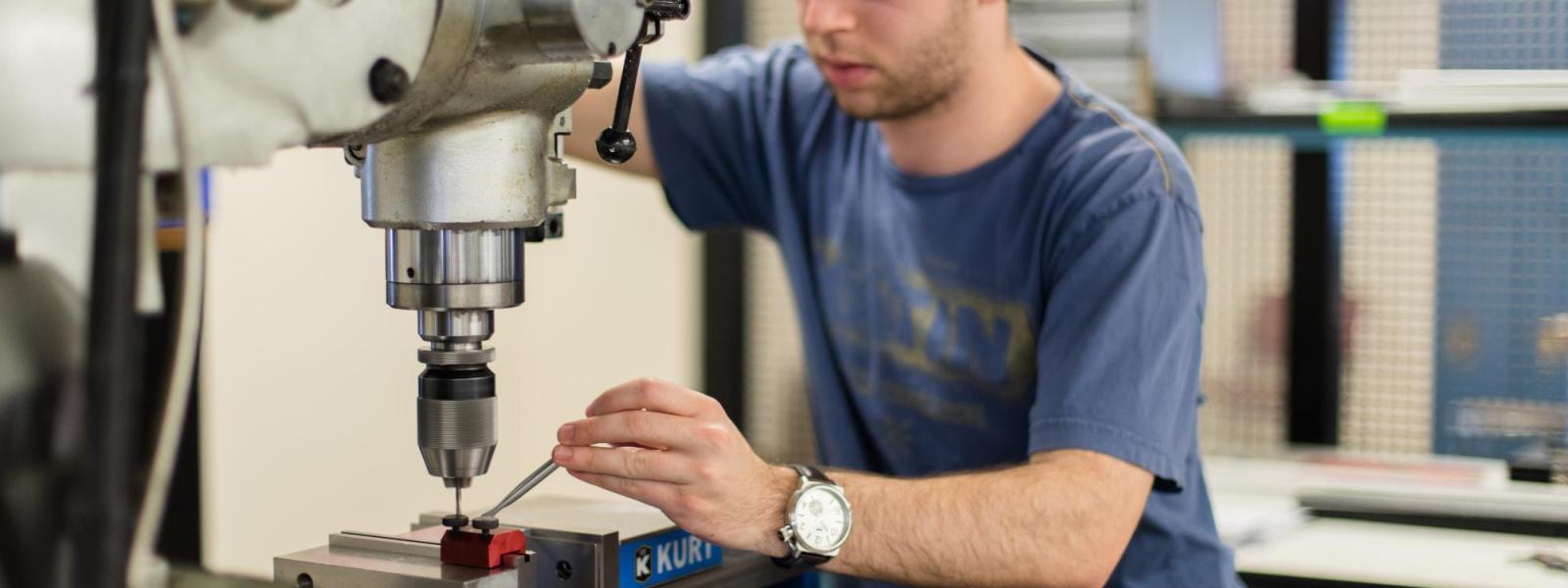 student using vertical mill