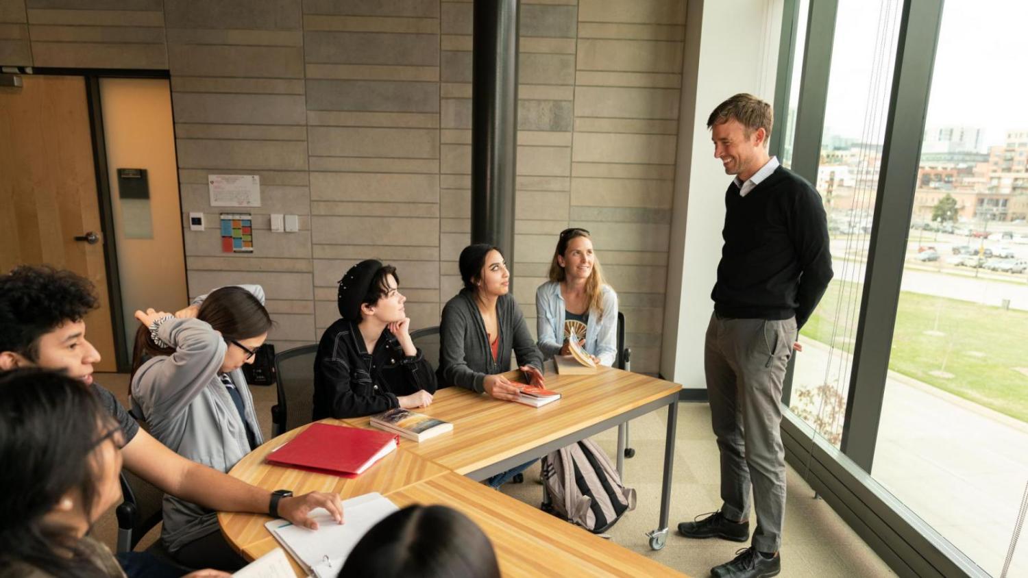 Faculty member talking to students