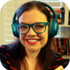 Faculty member, Casey Fiesler wearing green headphones.