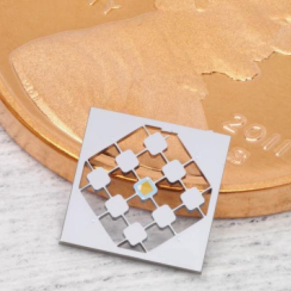Connecting microwave and optical frequencies through the ground state of a micromechanical object