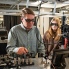 Scott Diddams and students in laboratory
