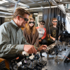 Scott Diddams working with students in the lab