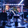 Kendall Mehling and Catie LeDesma with a new kind of atom "interferometer" on the CU Boulder campus