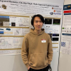 Ruijian Wang poses with his poster at a recent event