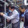 Ultrafast lasers, ultracold atoms and more as Rep. Neguse tours JILA