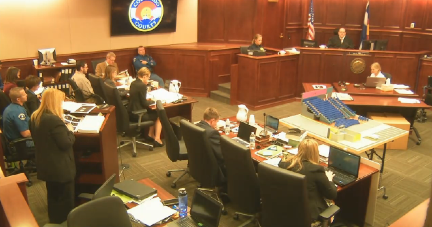 Aurora Police Department officer Maria Pettolina identifies evidence