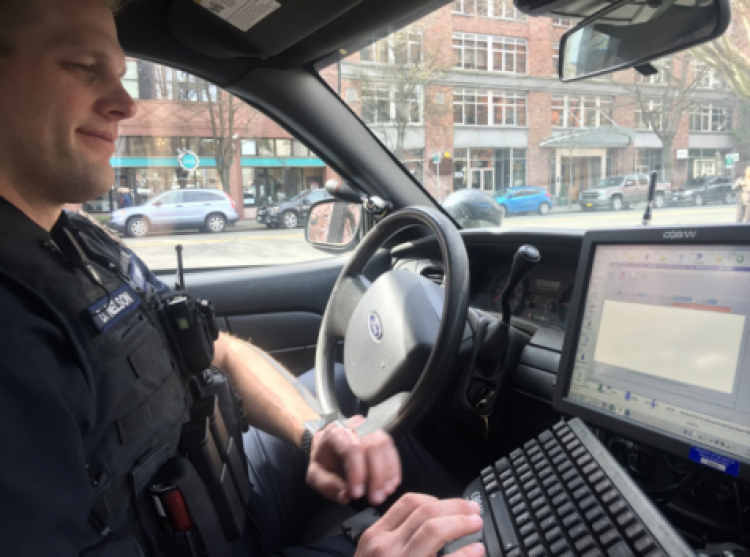 Stephanie Cook/CU News Corps Sgt. Dan Nelson fills out a report after responding to a shooting threat in downtown Seattle. These reports help SPD keep track of use-of-force incidents.