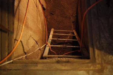 The view from the ground level of a home in Lyons into the flooded basement. (Robert R. Denton/CU News Corps)